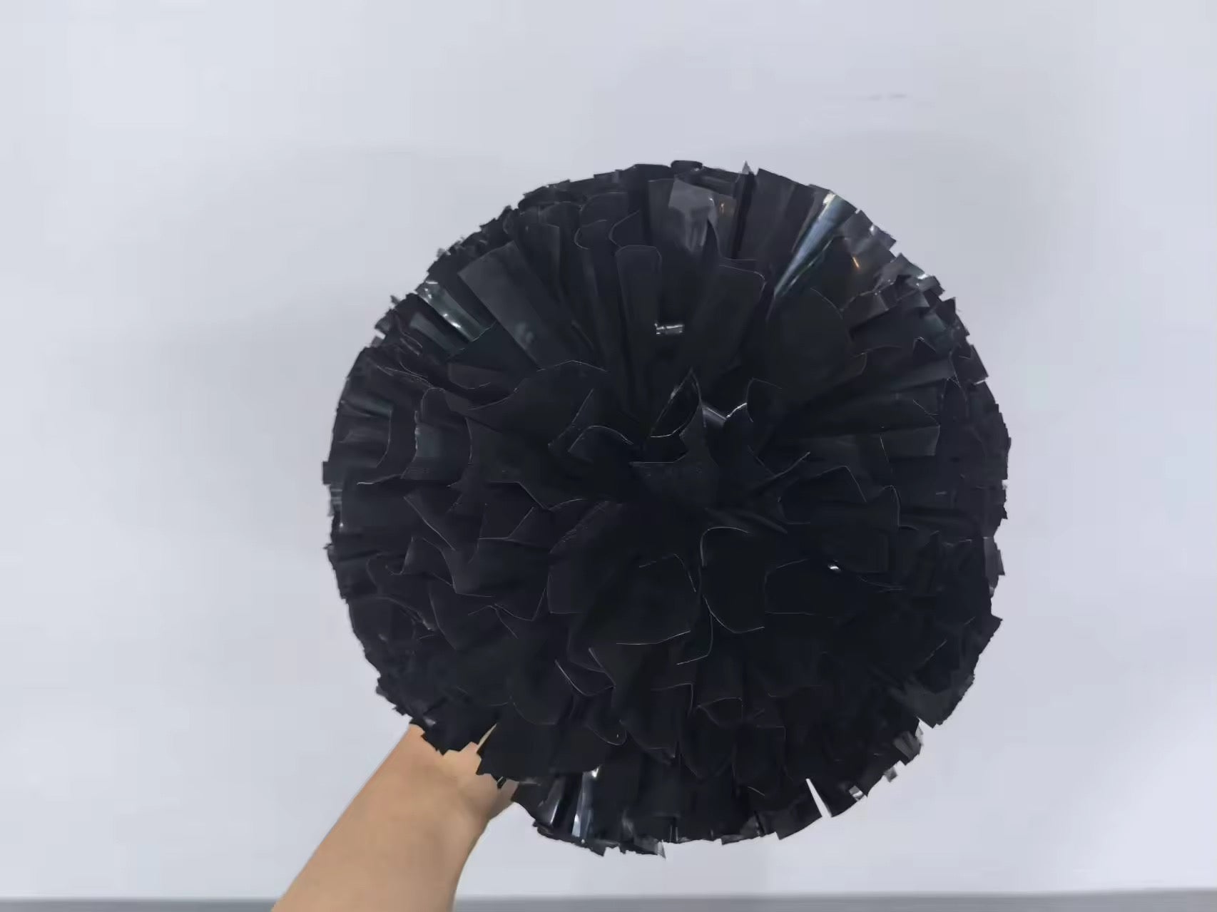 Fluffy black pompom