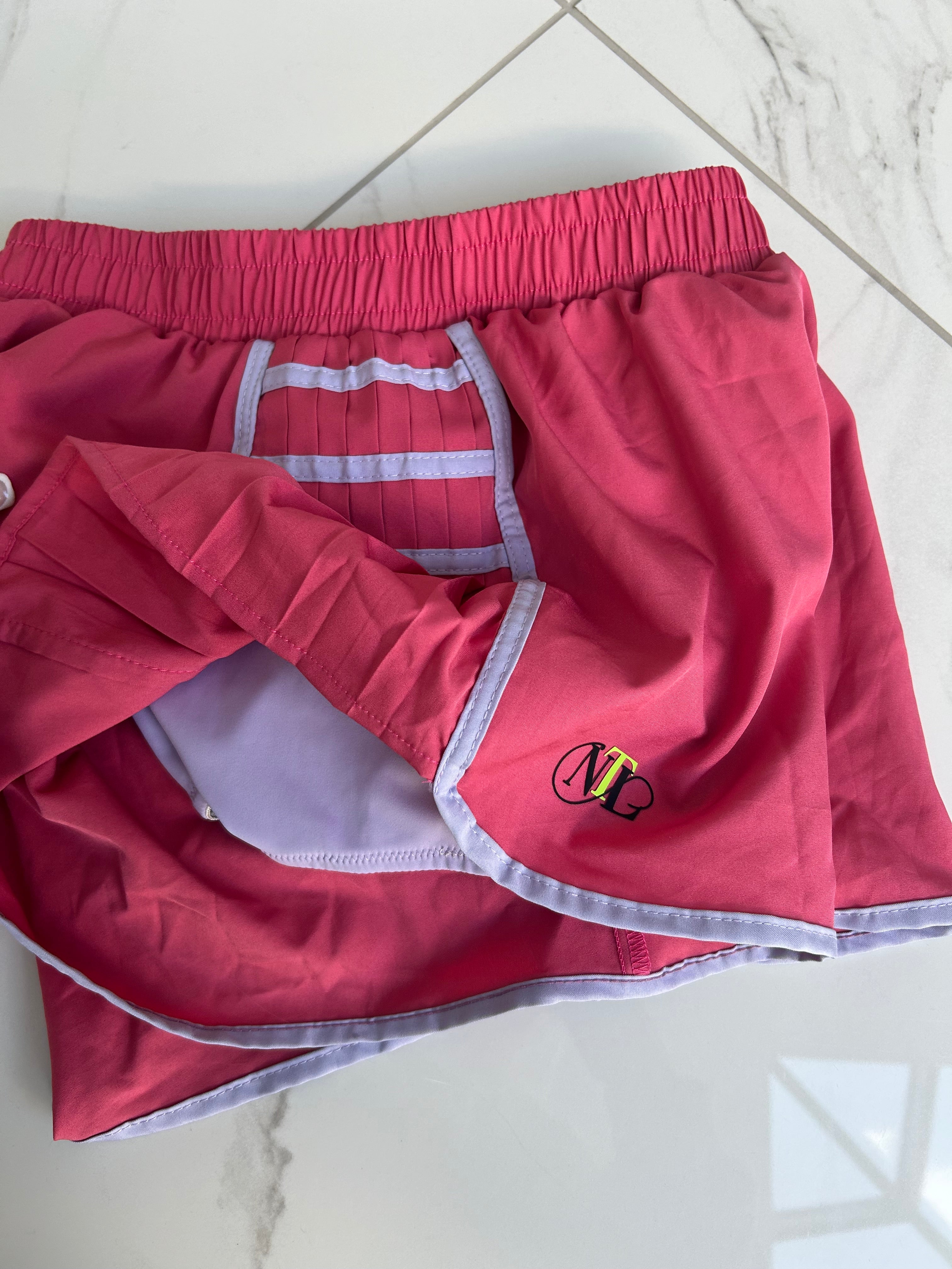 Raspberry tennis shorts