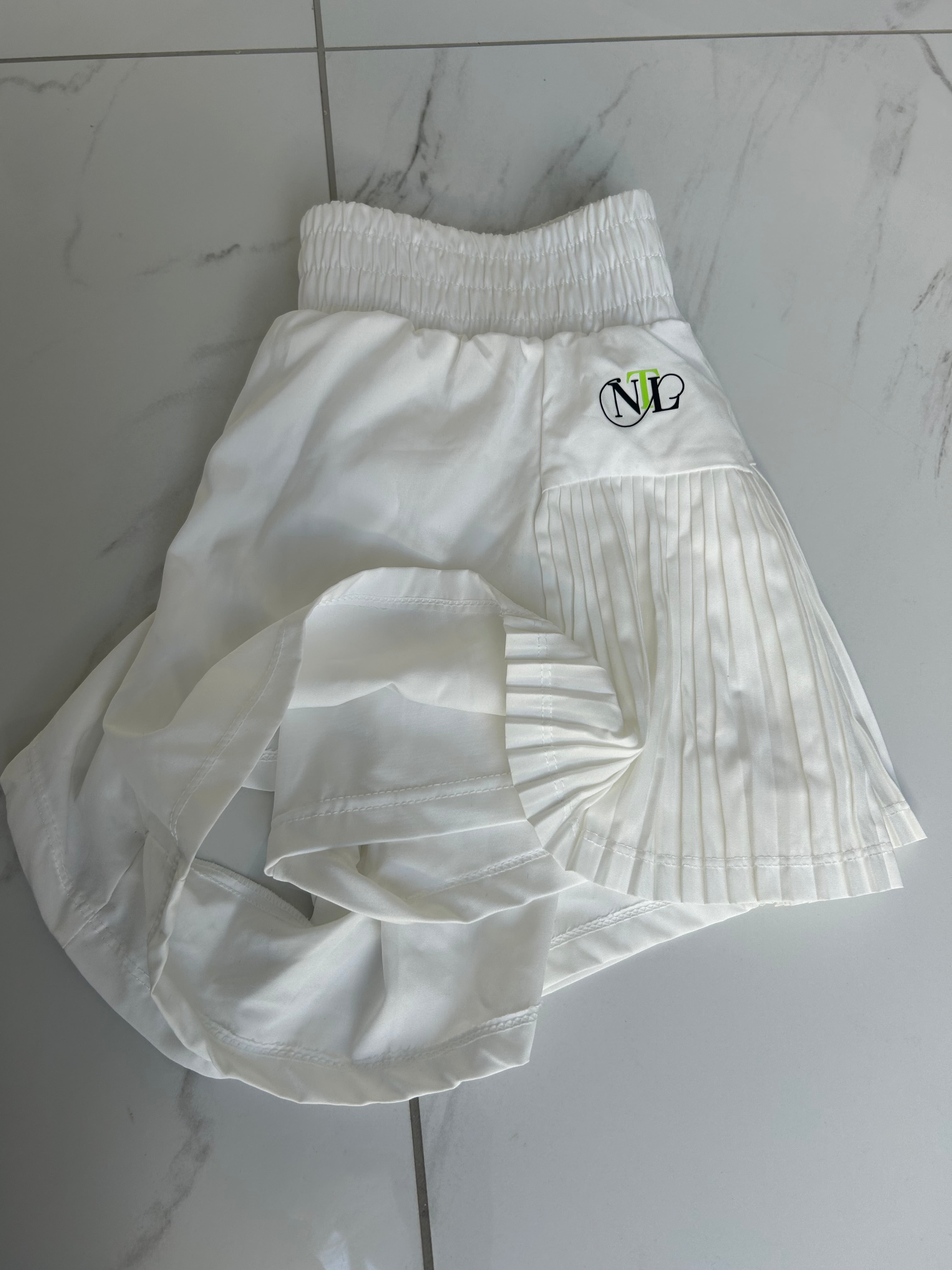White side pleat tennis shorts